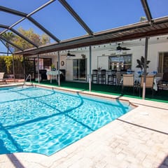 Coastal Coral Paradise with Heated Pool
